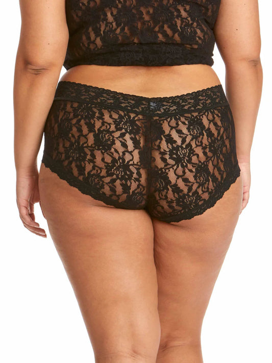 Black lace underwear worn by a model on a white background