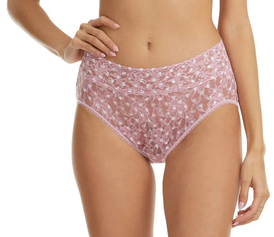 Person wearing a pink floral Underwear on a white background