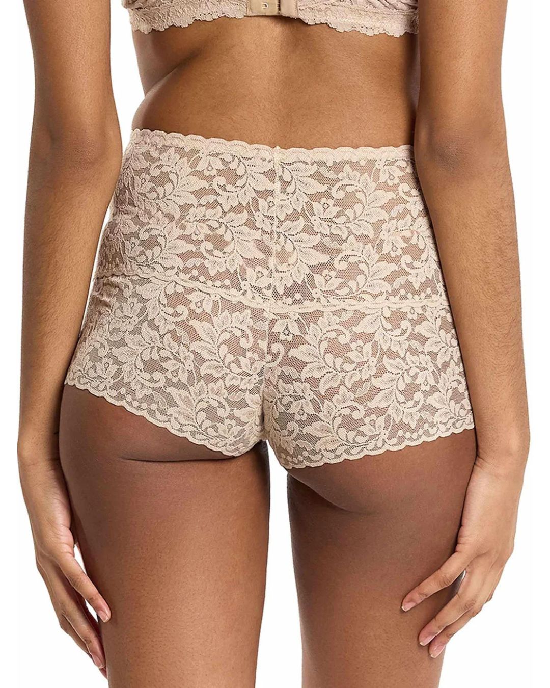 Lace underwear set worn by a model on a white background