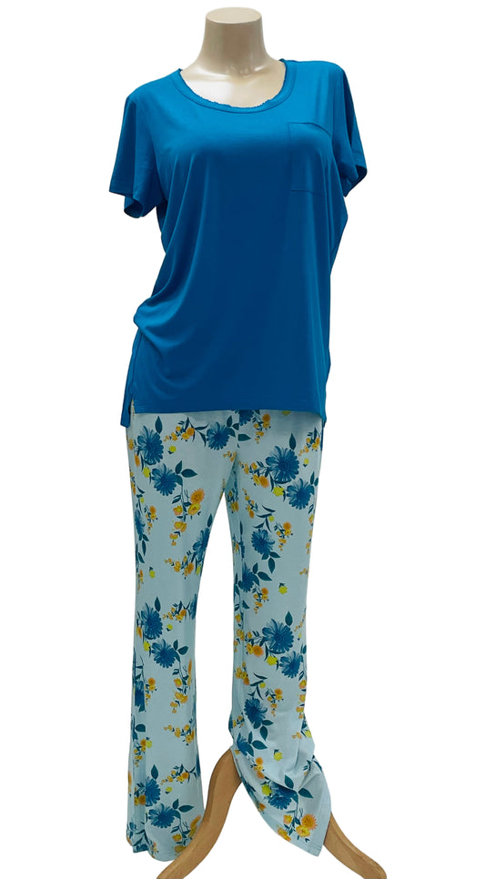 Mannequin wearing a blue top and floral pajama pants on a white background