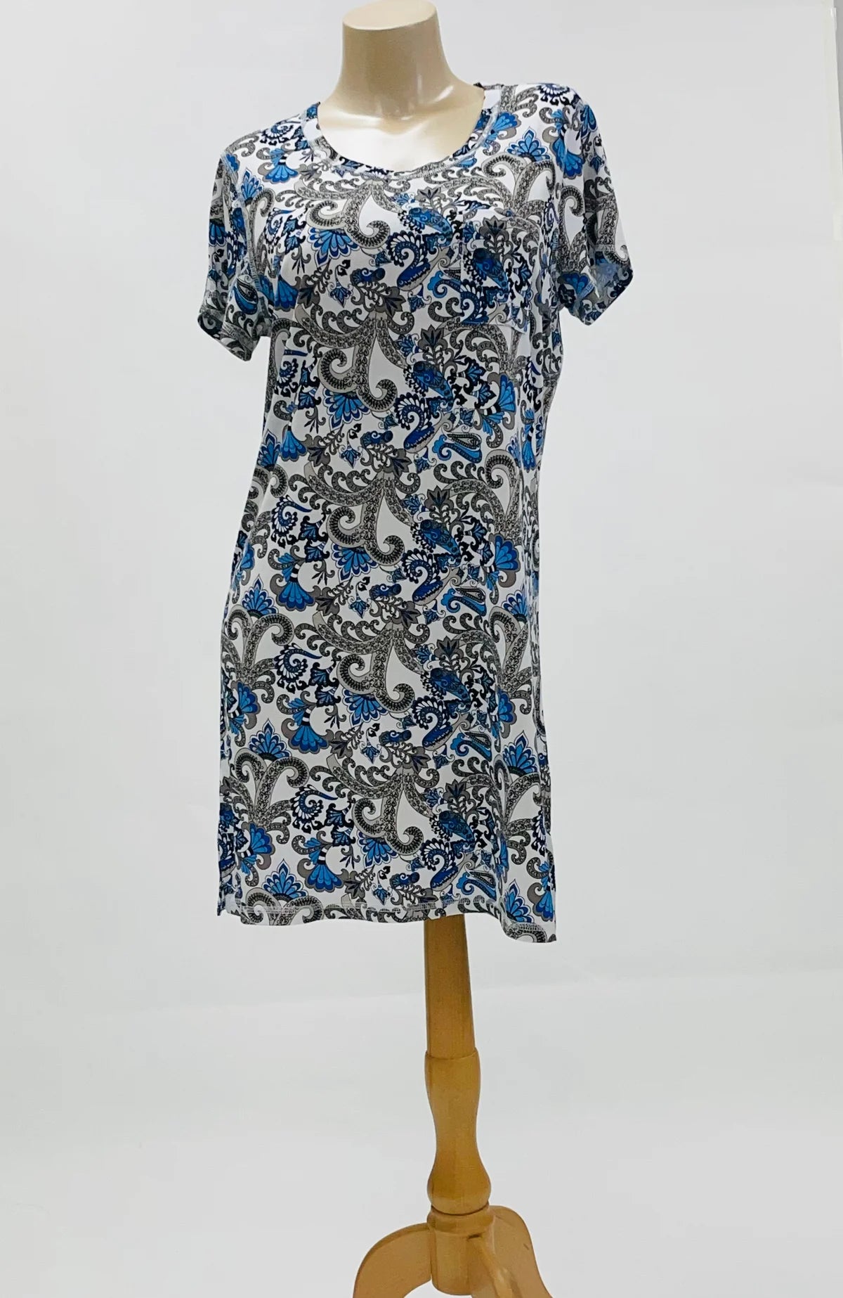Dress with blue and gray floral pattern on a mannequin against a white background