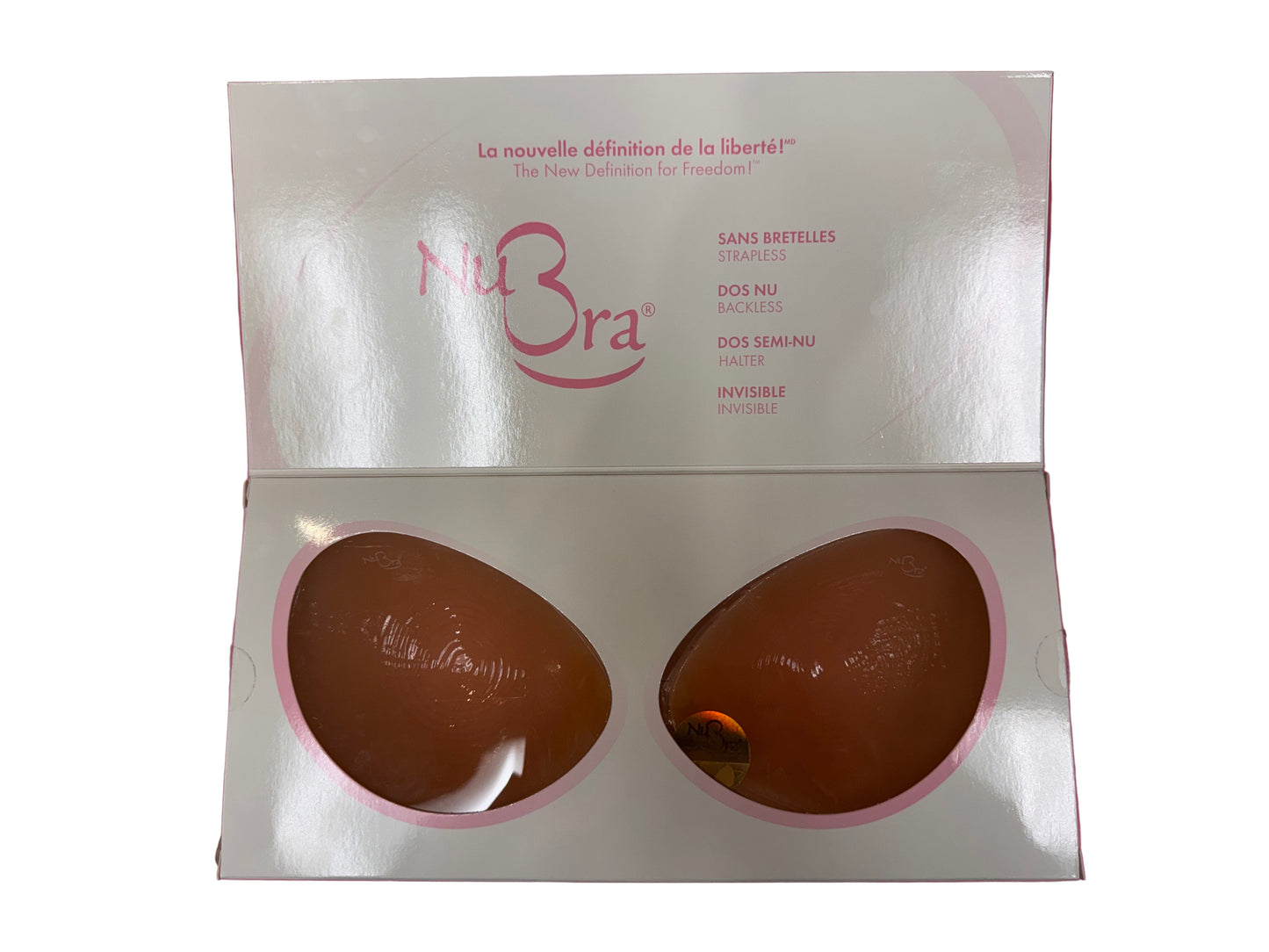 NuBra packaging with two silicone cups on a pink background