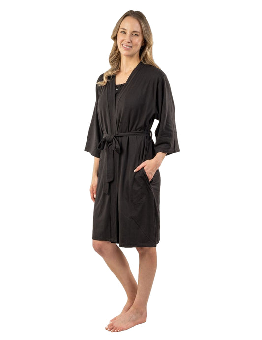 Woman wearing a black robe on a white background