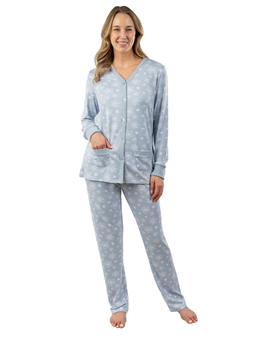 Woman wearing a light blue pajama set with a white background