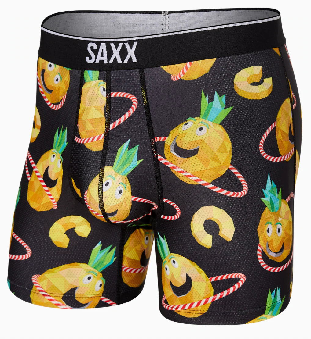 Boxer briefs with pineapple design and SAXX branding on a black background