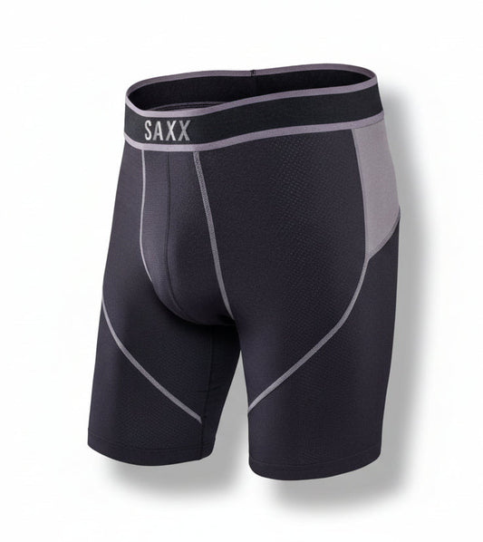 Black and gray compression shorts with SAXX branding on a white background