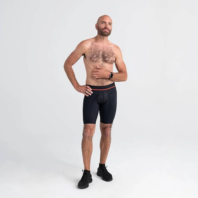 Man wearing black briefs on a white background