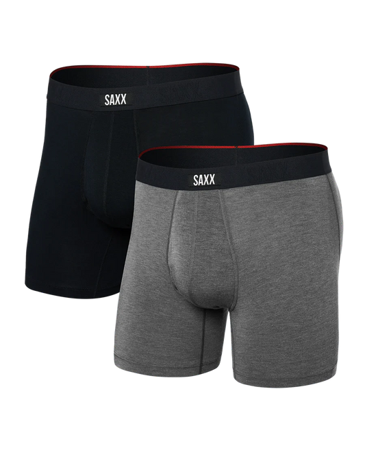 Two pairs of SAXX boxer briefs, one black and one gray, on a white background.
