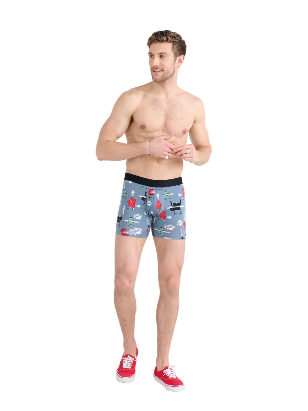 Man wearing gray boxer briefs with car pattern on a white background