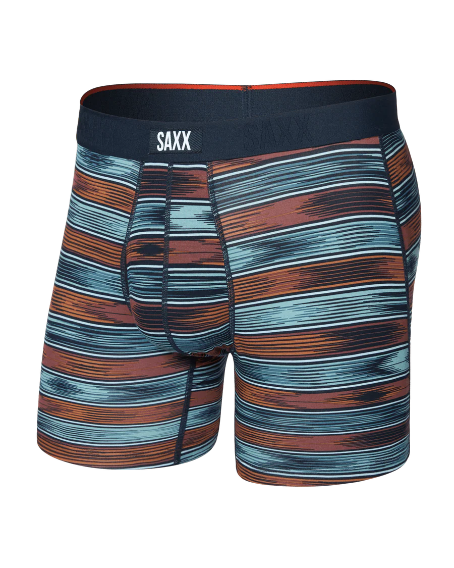 Striped boxer briefs with SAXX branding on a white background