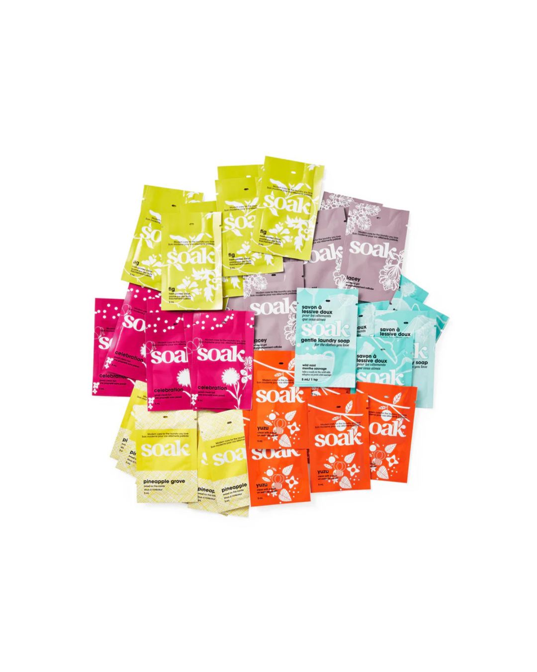 Assorted colorful packaging of Soak laundry detergent pods on a white background