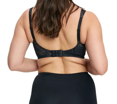 Woman wearing a black lingerie set on a white background