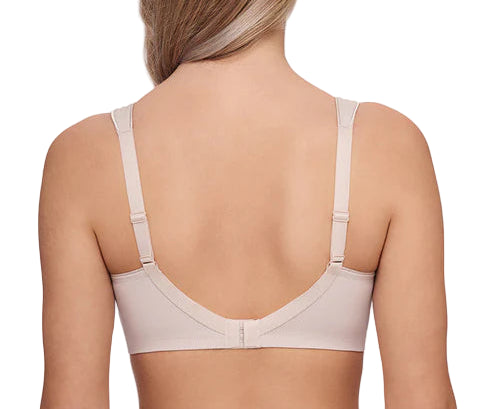 Woman wearing a beige bra on a white background