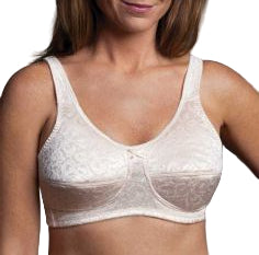 Woman wearing a white lace bralette against a neutral background