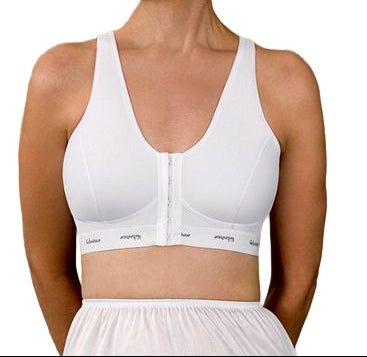 Woman wearing a white sports bra and underwear set against a beige background