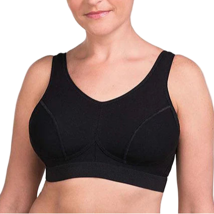 Woman wearing a black sports bra against a plain background