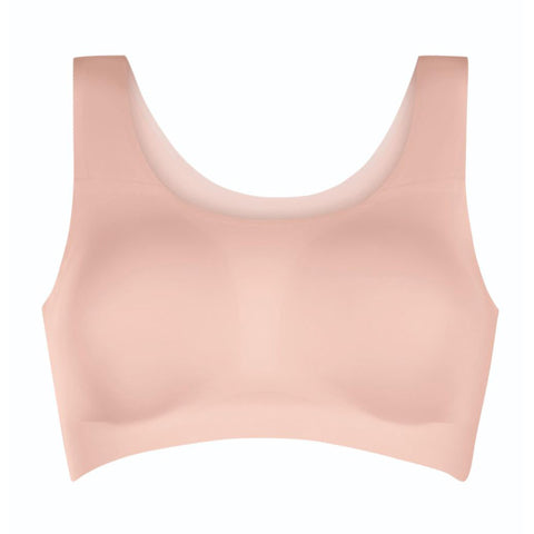 A seamless, wireless scoop-neck bra in a soft peach-pink color, shown against a plain white background.