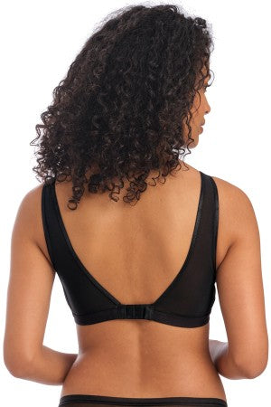 Woman wearing a black mesh bra on a white background