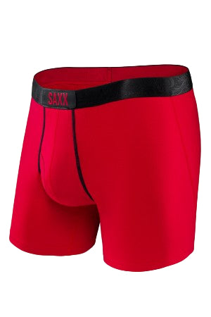 Red SAXX boxer briefs with black waistband on a white background