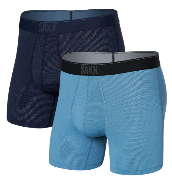 Two pairs of SAXX boxer briefs, one blue and one navy, on a white background.
