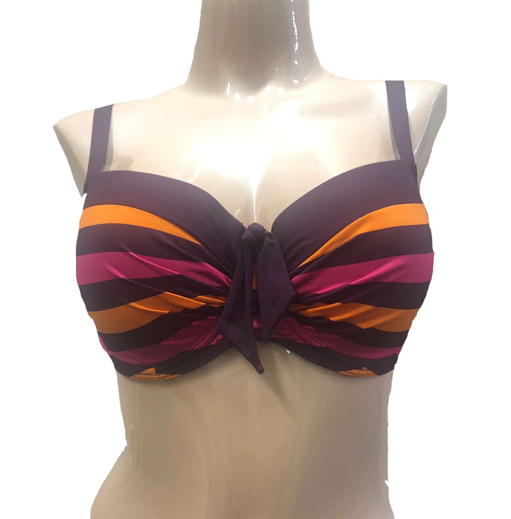 A bikini top in plum purple, tangerine orange, and punch pink with a bow detail in the front and ruching detail across cups, displayed on a mannequin.